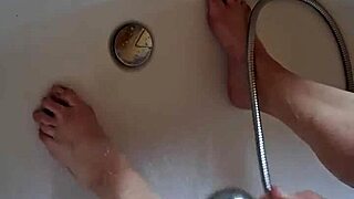 washing dirty mature german feet in bathtub
