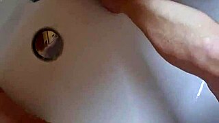 washing dirty mature german feet in bathtub