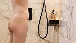 black hair japanese girl bathes skinny body in steamy shower