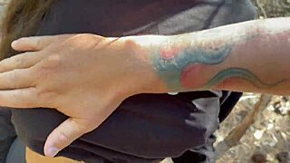 she grabs both cocks for double suck