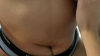 Touching her navel while she jerks me off