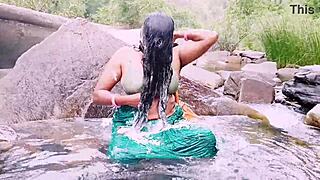 VILLAGE AUNTY BATHES UNDER WATERFALL WITH DIRTY TELUGU TALKS!