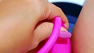 pretty girl fingers her wet pink pussy in office bathroom