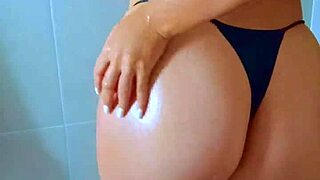 check out this brazilian beauty's wet thong clinging to her ass in steamy shower