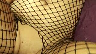 Wife slips into erotic fishnet lingerie for homemade milf porn shoot