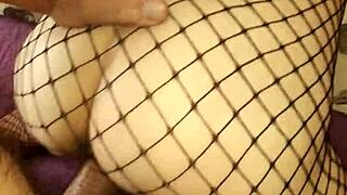 Wife slips into erotic fishnet lingerie for homemade milf porn shoot