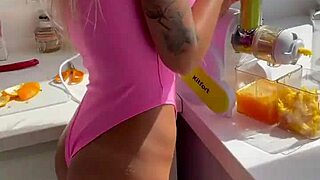 Monika Fox Strips Pink Bodysuit Teasing Shaved Pussy in Kitchen