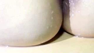 This adorable big ass redhead poses nude then rides to creampie in villa