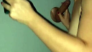 Amateur wife kneels at cinema gloryhole sucking stranger cocks