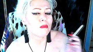 next door milf in fishnets toys her shaved pussy moaning wildly on cam