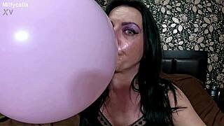satin balloon pops while she teases barefoot in pajamas