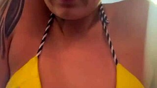 Gym babe in tiny bikini trains beachfront gets soaking wet from dripping arousal down legs