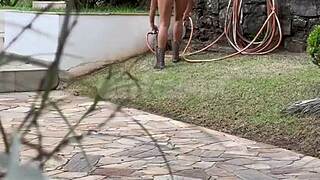 Handyman spies on busty blonde wife masturbating solo by the riverbank
