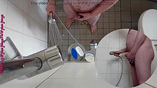 Sexy German babe pisses wildly in the steamy shower.