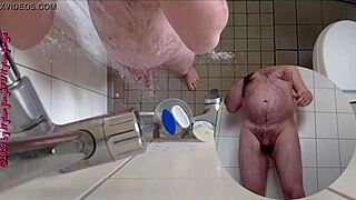 Sexy German babe pisses wildly in the steamy shower.