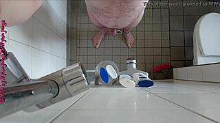 Sexy German babe pisses wildly in the steamy shower.