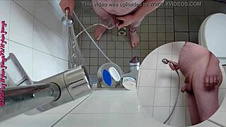 Sexy German babe pisses wildly in the steamy shower.