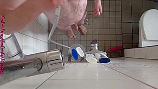 Sexy German babe pisses wildly in the steamy shower.