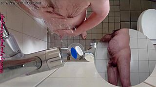 Sexy German babe pisses wildly in the steamy shower.