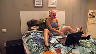 a pink pig plays with cream on her tits and pussy with a big dildo