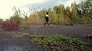 outdoor pissing a milf urinates while walking in a public park and by the sea